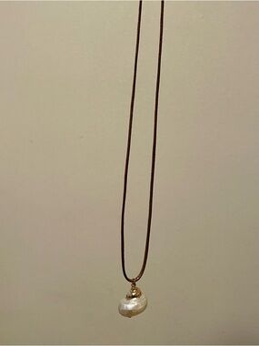 Unlisted White Shell Pendant on Black Cord Necklace